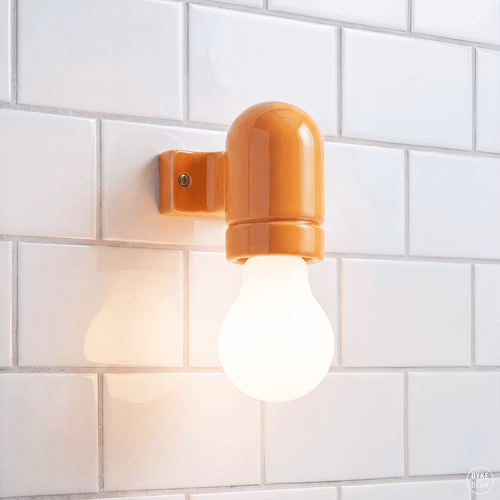Peach orange ceramic wall arm light - DYKE & DEAN