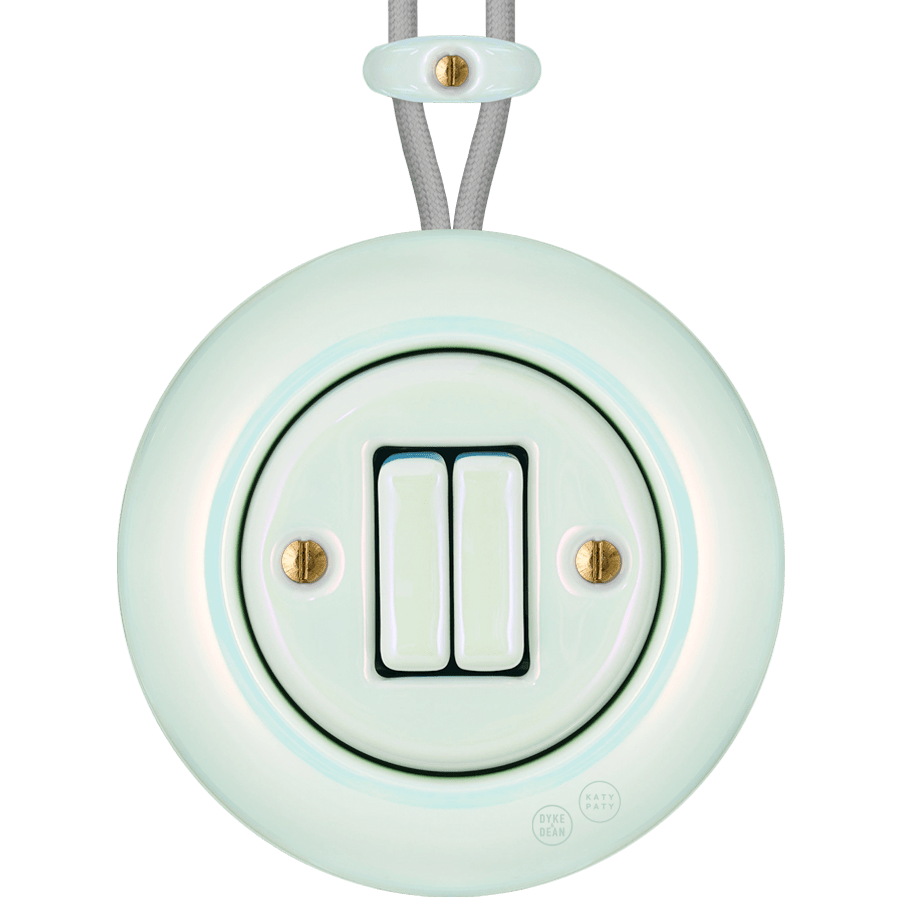 PORCELAIN KATY PATY COLONA ROUND SURFACE MOUNTED DOUBLE SLIM BUTTON SWITCH CONCHA - DYKE & DEAN