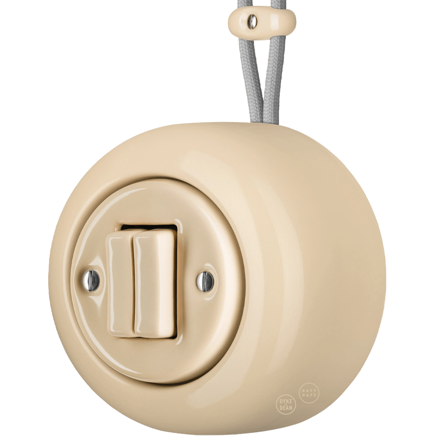 PORCELAIN ROUND SURFACE MOUNTED DOUBLE SLIM BUTTON SWITCH SAND - DYKE & DEAN