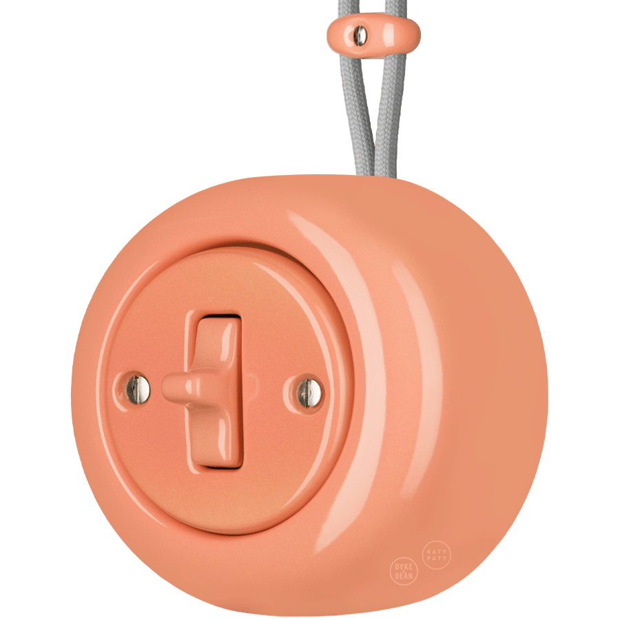 PORCELAIN ROUND SURFACE MOUNTED TOGGLE BUTTON SWITCH SALMON PINK - DYKE & DEAN